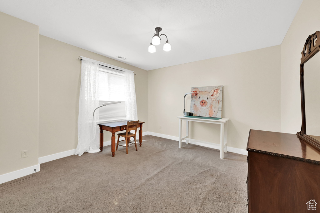 Interior space featuring light colored carpet and baseboards