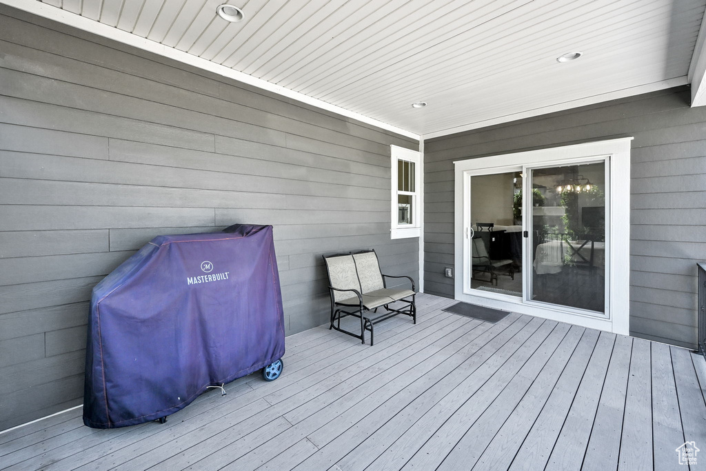 Wooden terrace featuring area for grilling