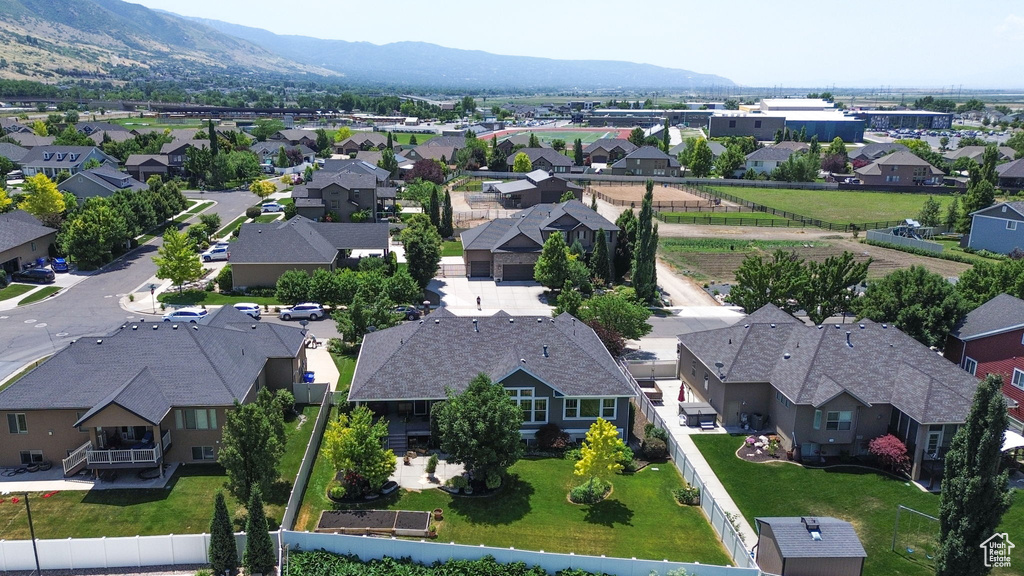 Aerial perspective of suburban area featuring a mountain backdrop