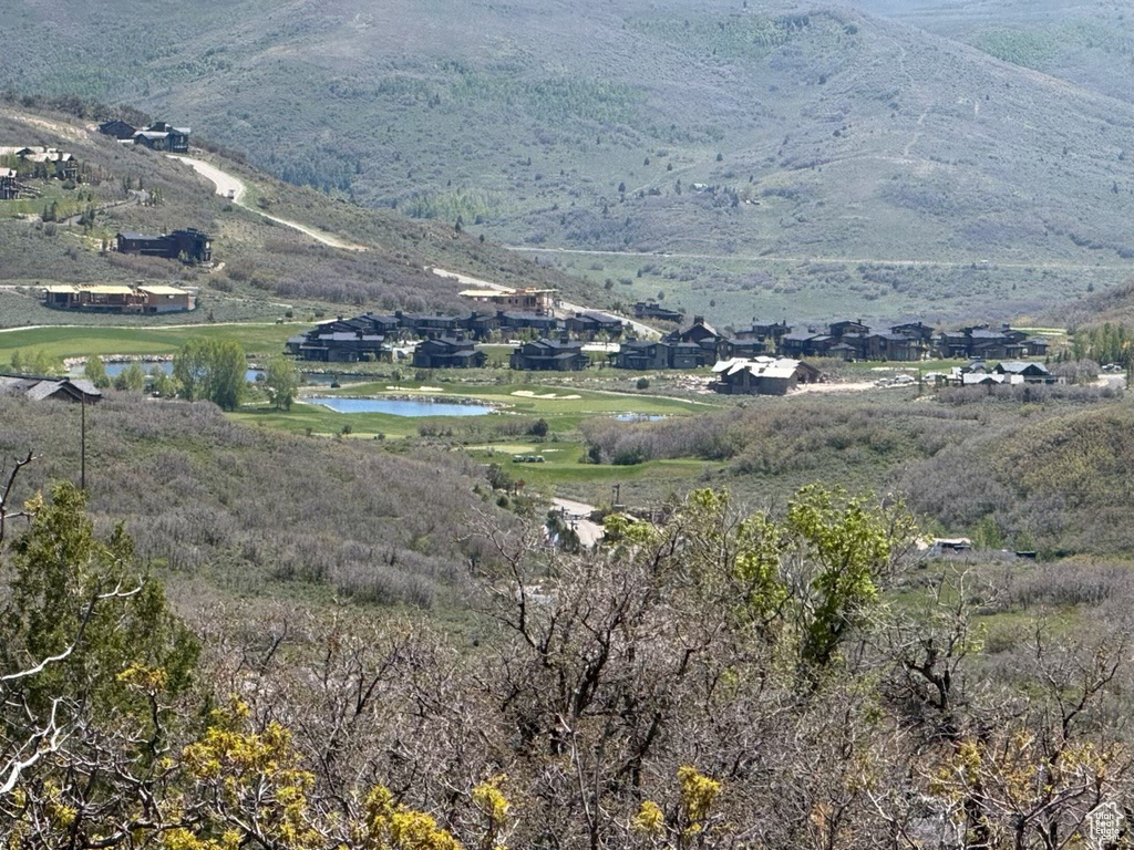 View of mountain backdrop with a nearby body of water