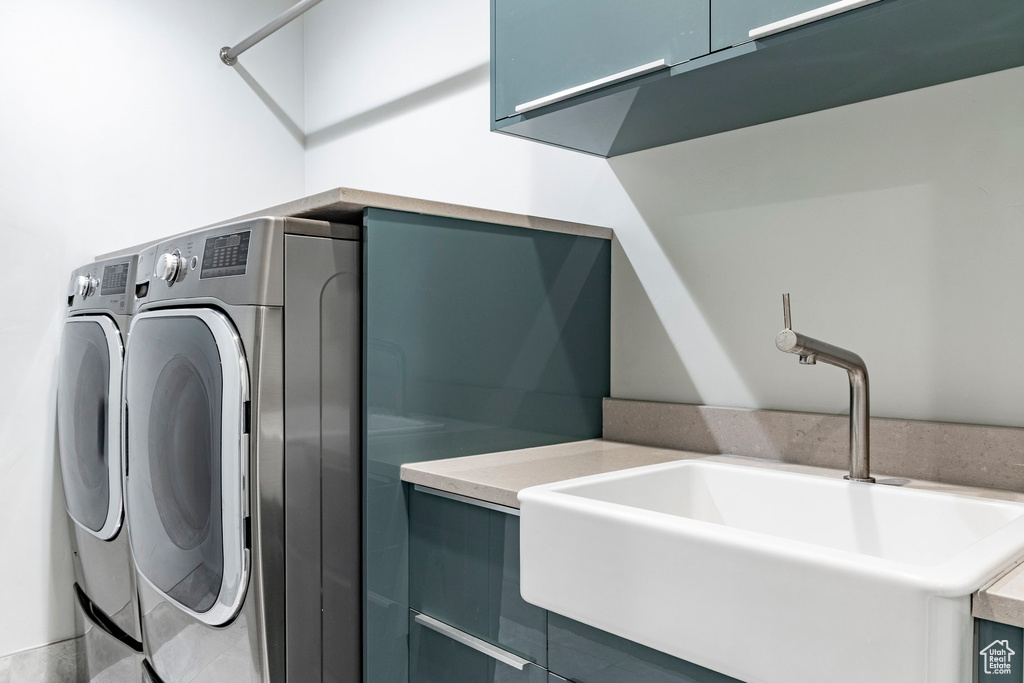 Laundry room featuring cabinet space and washing machine and dryer
