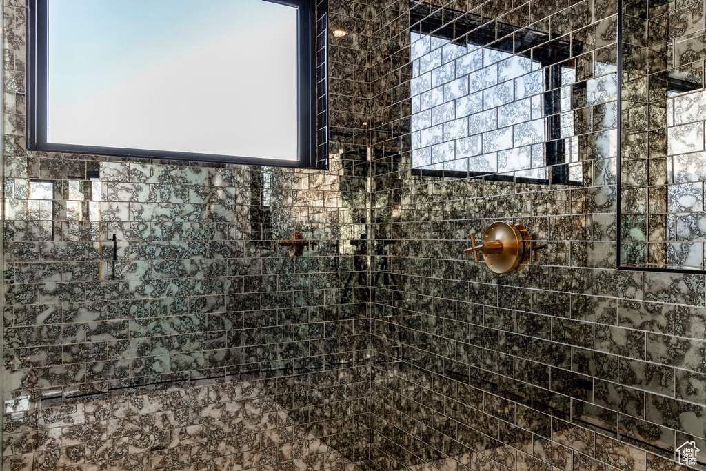 Bathroom featuring a tile shower