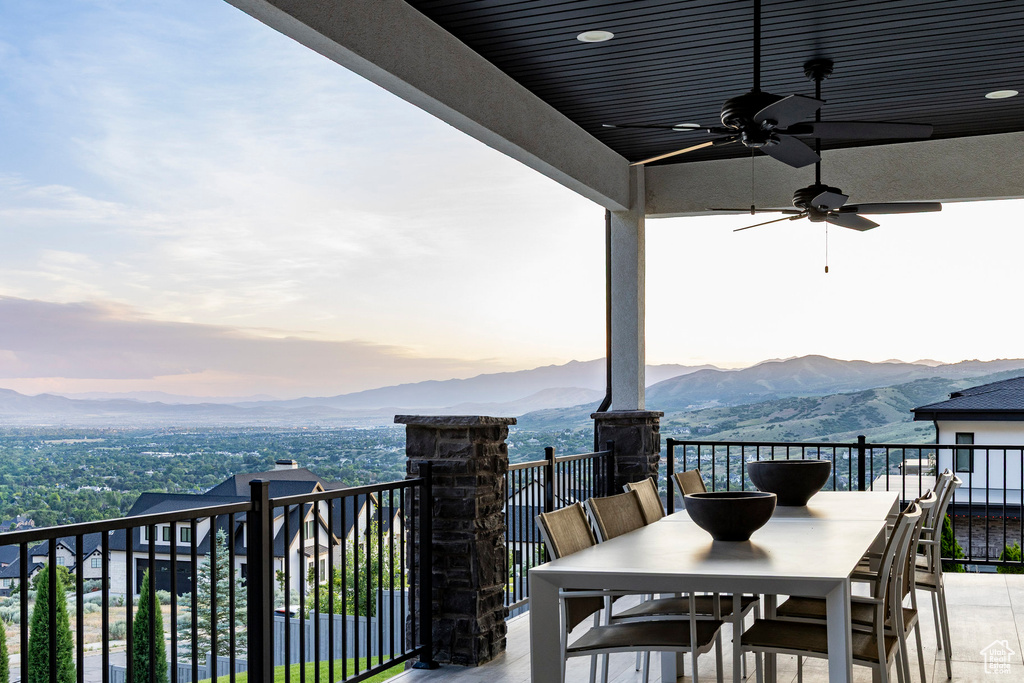 Patio / terrace with a mountain view, ceiling fan, and outdoor dining area