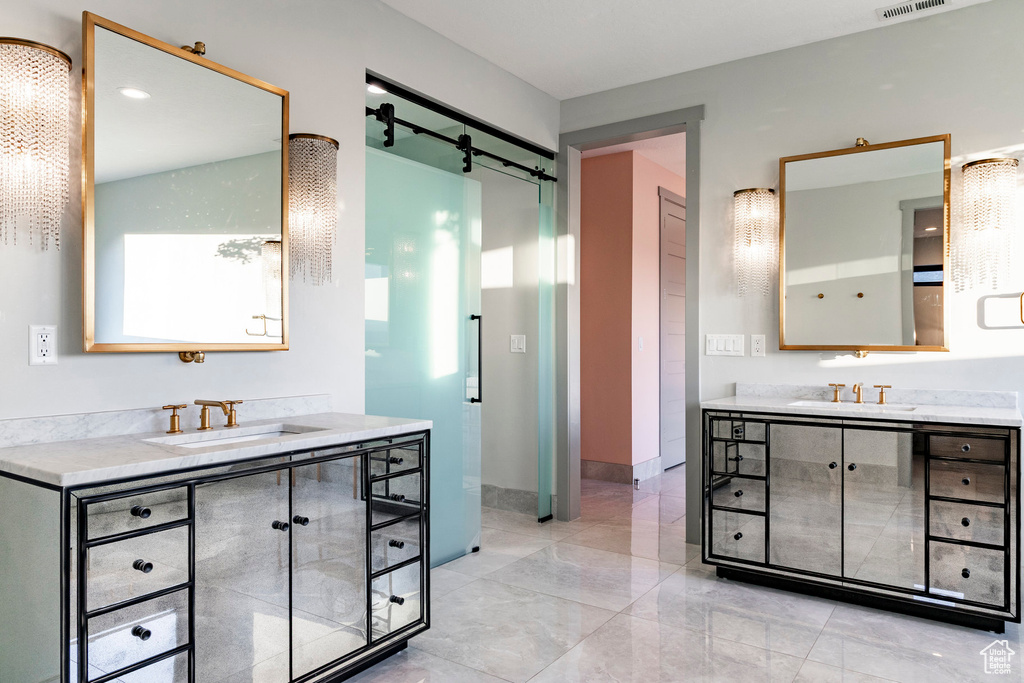 Bathroom with two vanities and baseboards