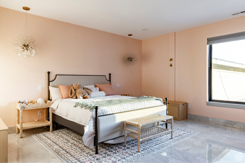 Bedroom featuring a chandelier