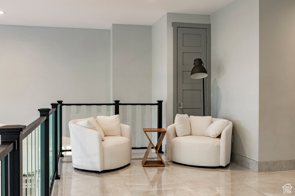 Sitting room featuring baseboards