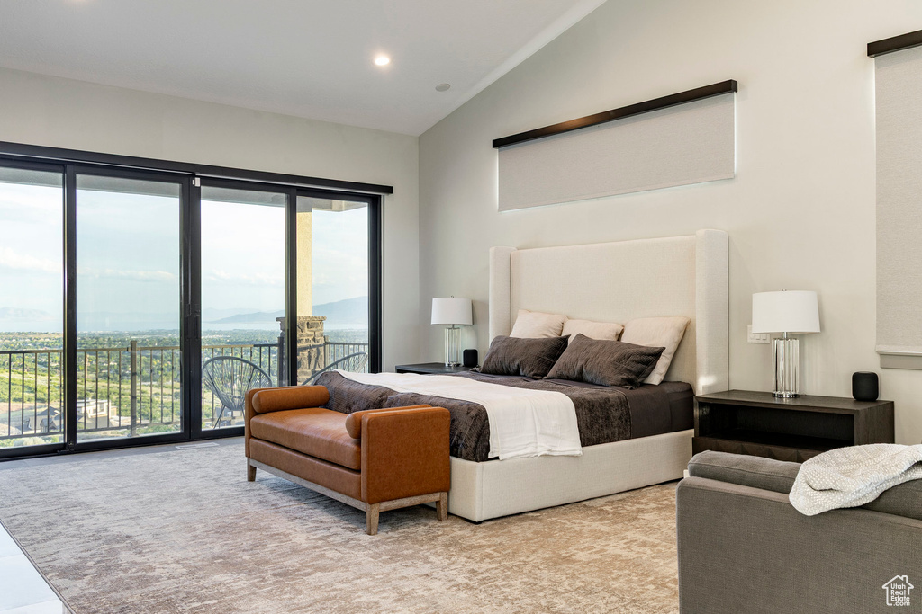 Bedroom featuring access to exterior, multiple windows, recessed lighting, and high vaulted ceiling