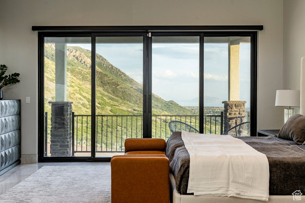 Bedroom with access to exterior and multiple windows