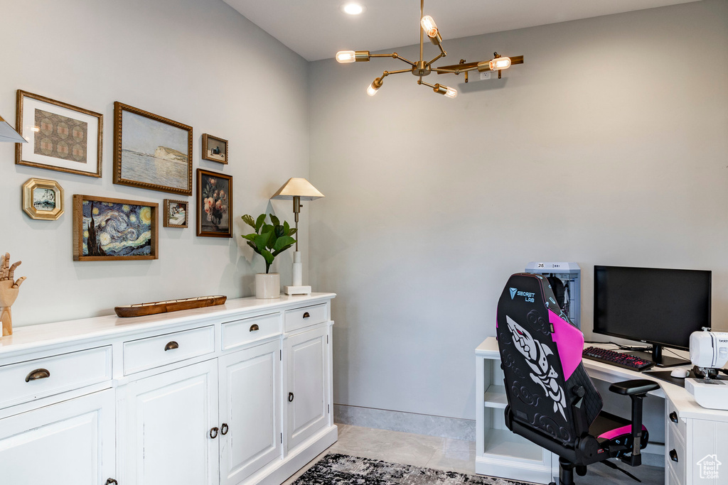 Office area featuring a chandelier and light tile patterned flooring