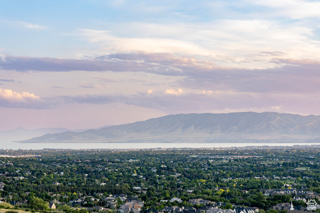 View of mountain backdrop featuring a nearby body of water