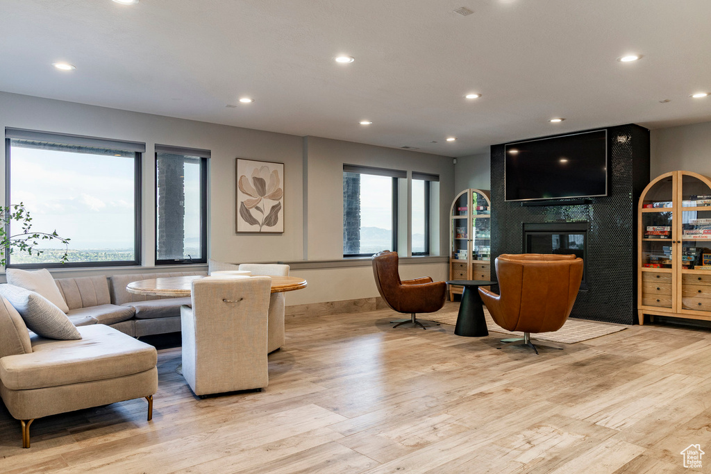 Living room featuring light wood-style floors and recessed lighting