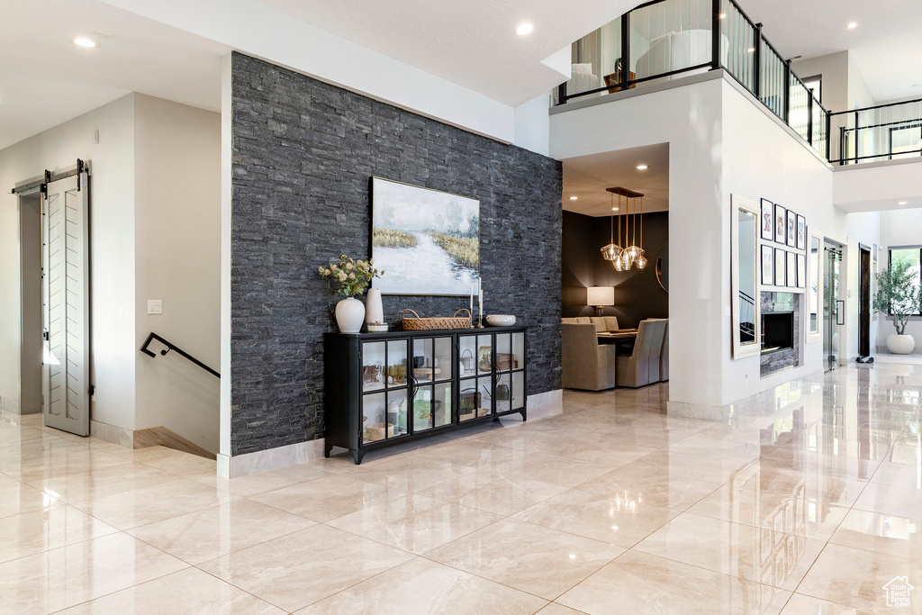 Lobby with a towering ceiling and recessed lighting