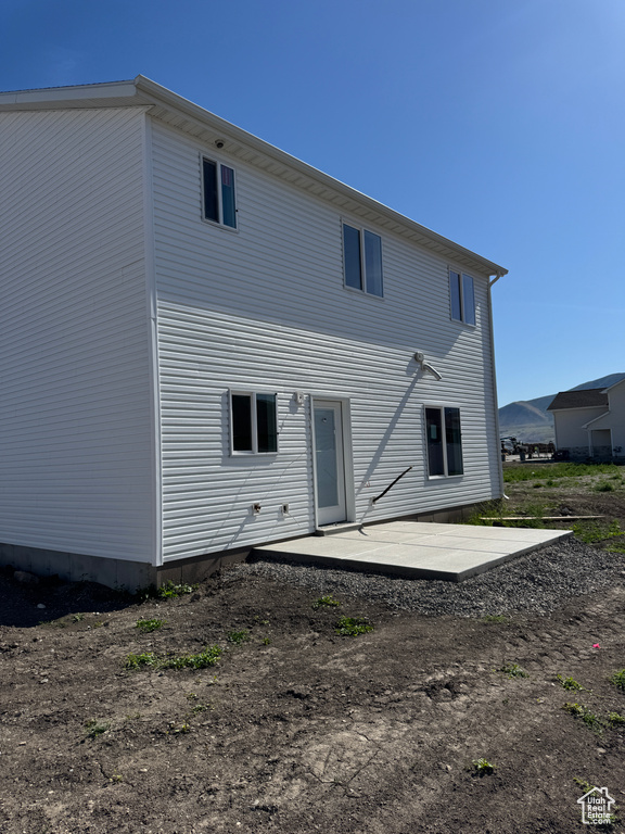 Rear view of house featuring a patio area