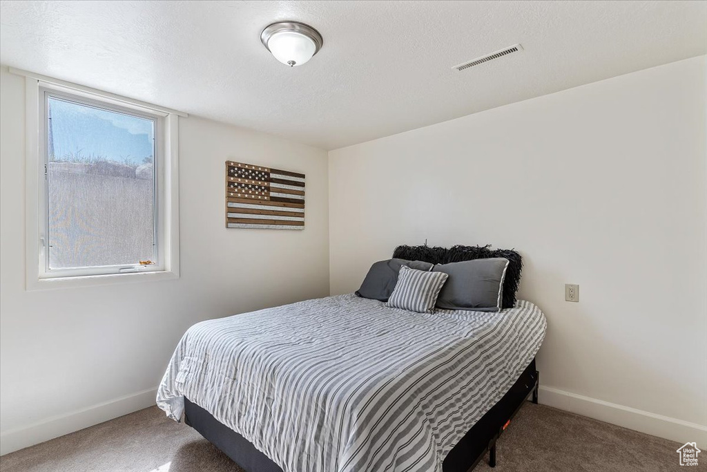 Bedroom featuring carpet