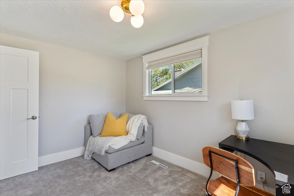 Living area featuring carpet flooring