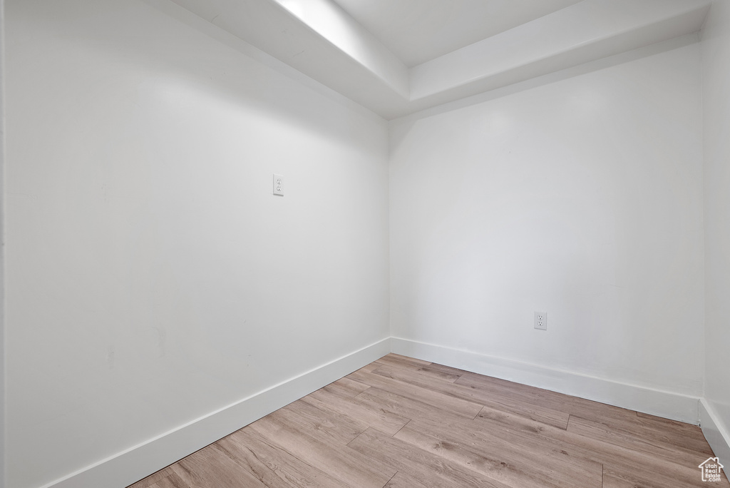 Unfurnished room featuring light wood-style flooring and baseboards