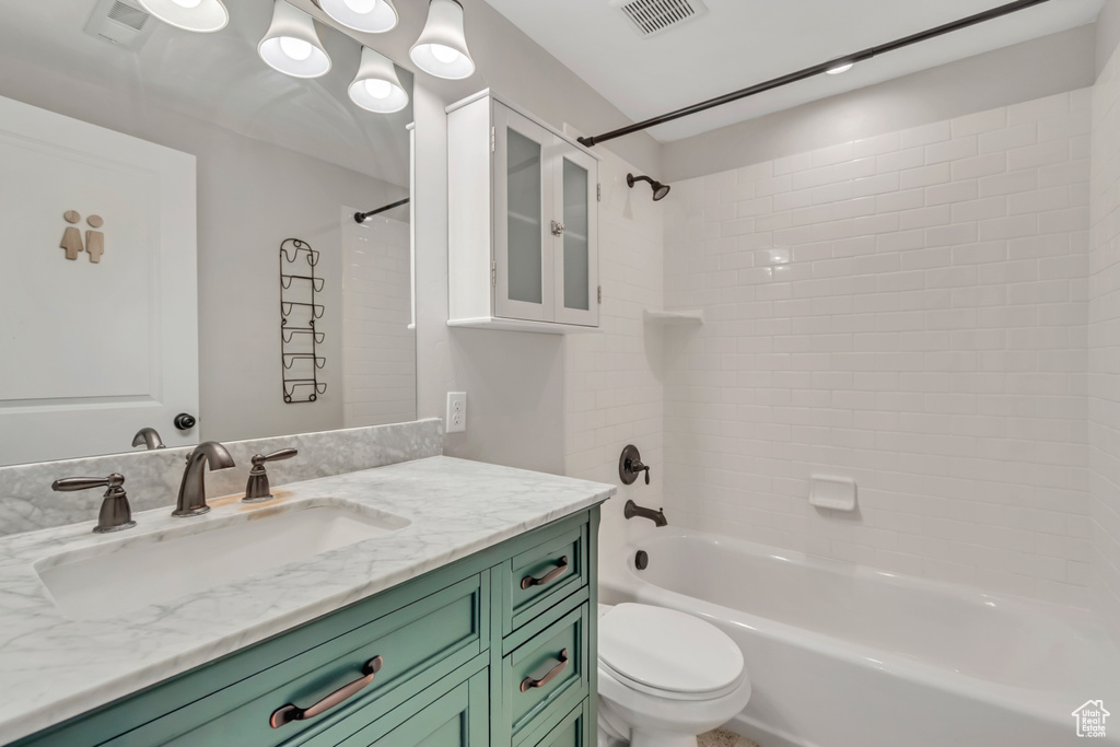 Bathroom with shower / washtub combination and vanity