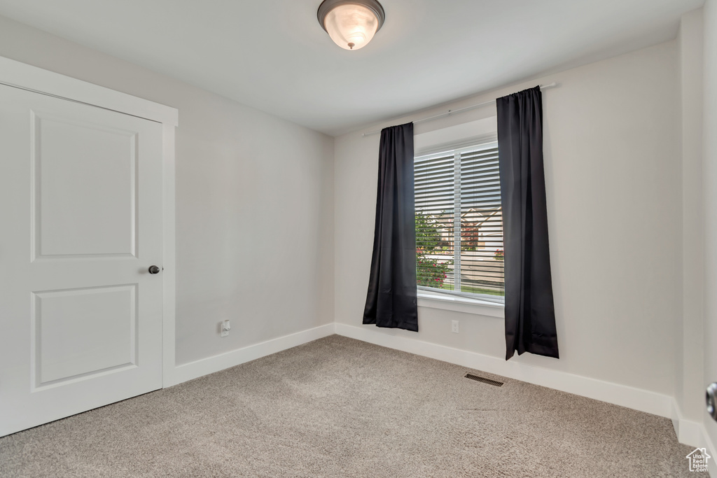 Empty room featuring carpet flooring