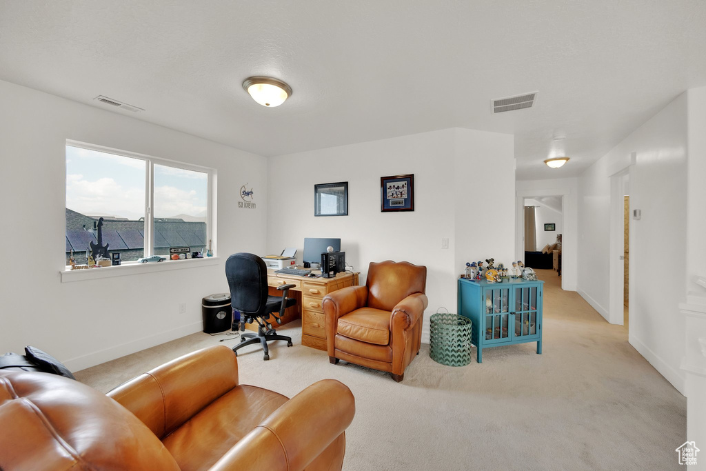 Carpeted office featuring baseboards