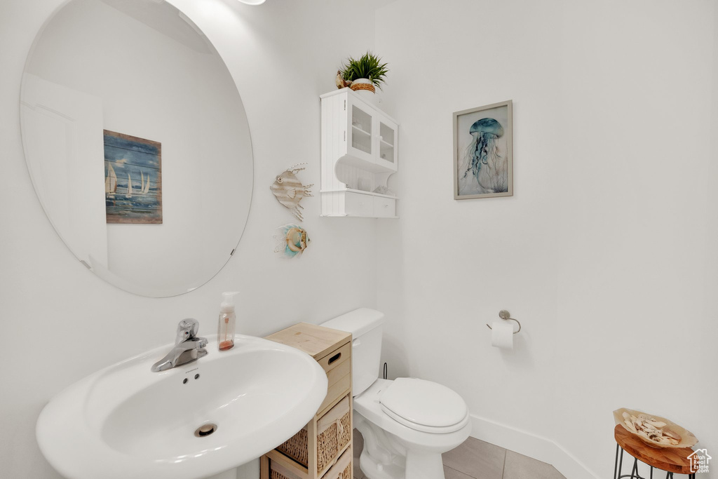 Bathroom featuring a sink and tile patterned floors