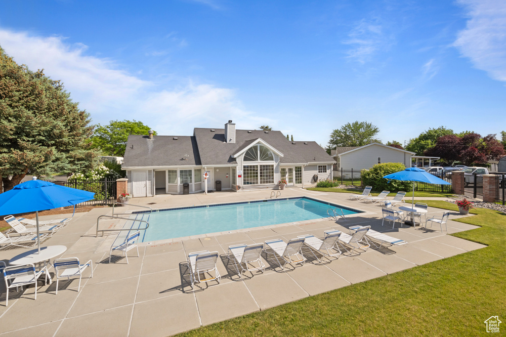 Community pool with a patio area