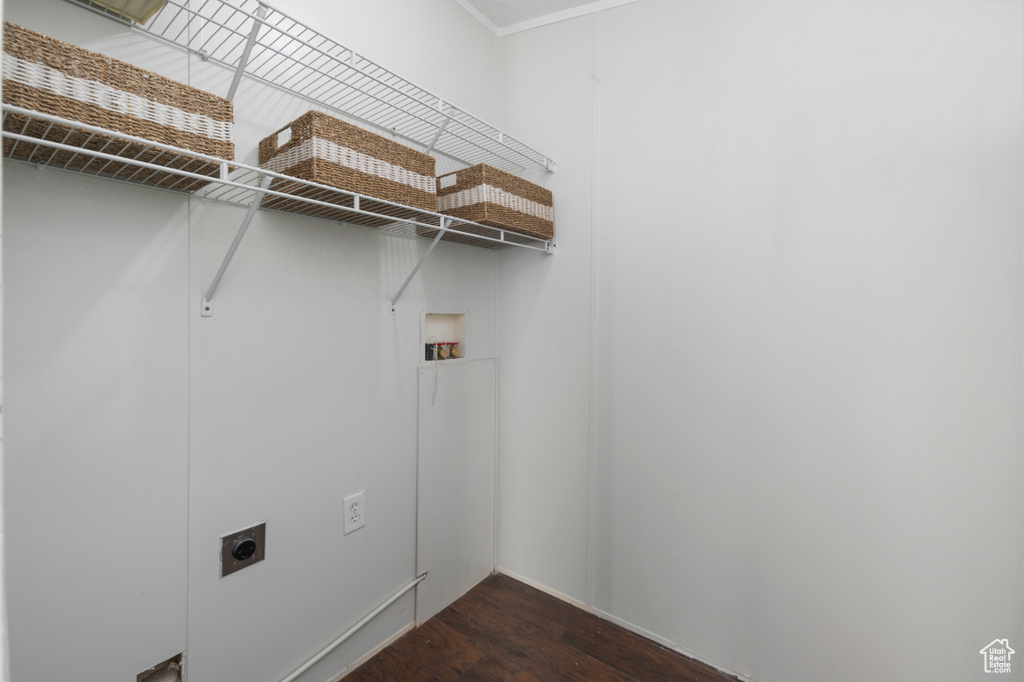 Washroom with electric dryer hookup, dark wood-style floors, and hookup for a washing machine