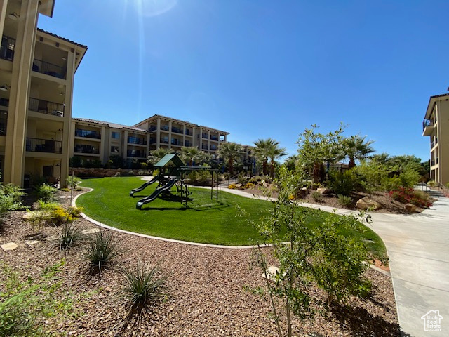 View of home's community featuring a yard