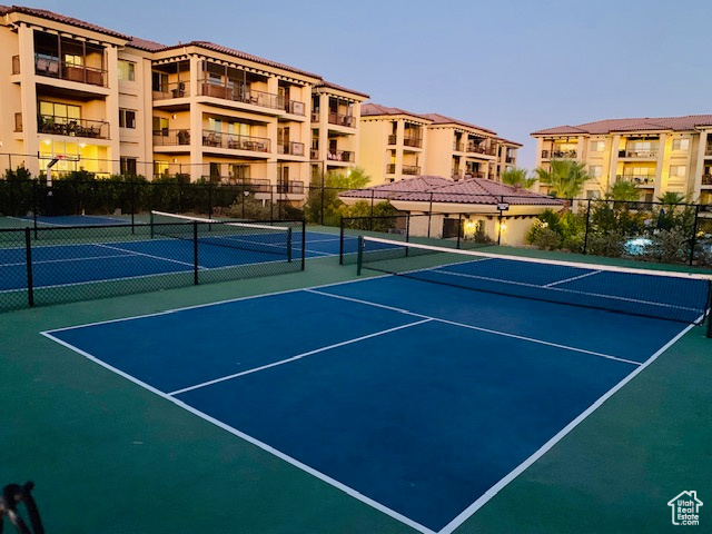 View of tennis court featuring community basketball court
