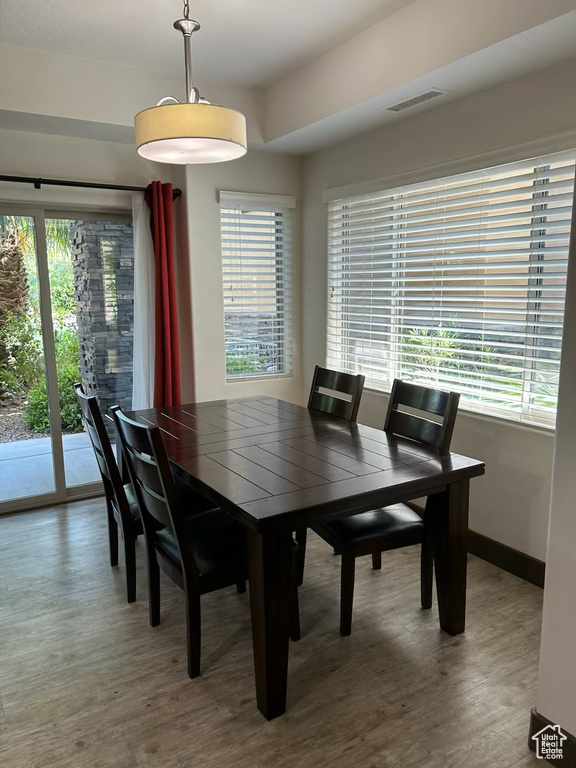 Dining room with wood finished floors and baseboards