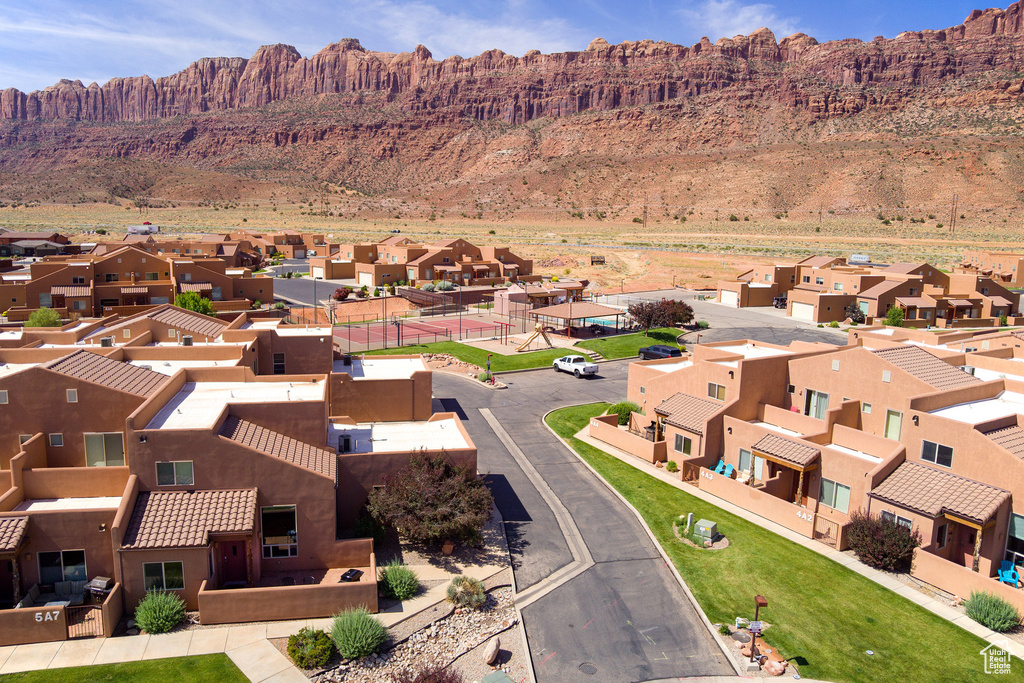Aerial view of residential area with a mountain backdrop