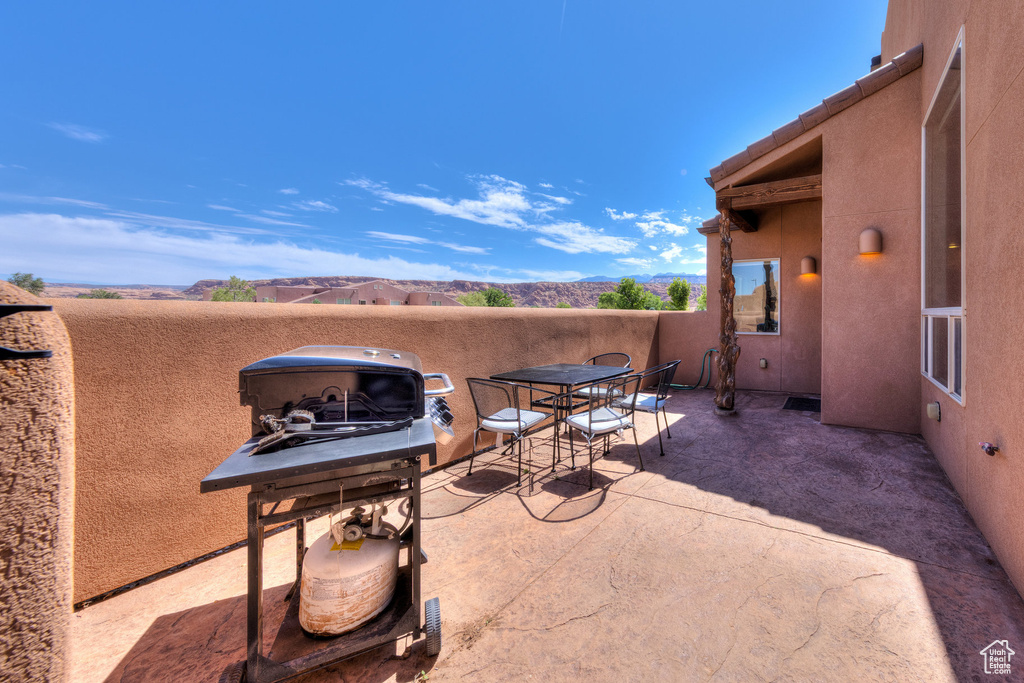 View of patio / terrace featuring a mountain view and outdoor dining space