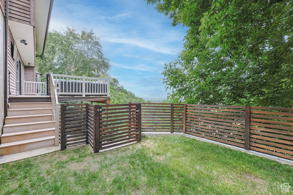 View of yard with a deck