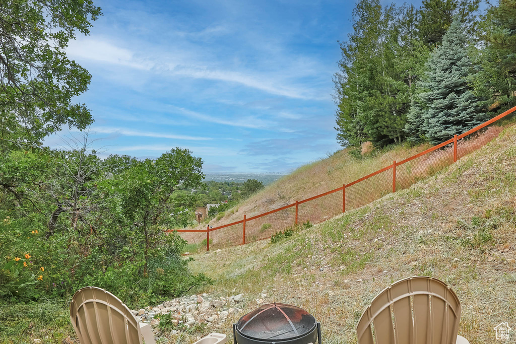 View of yard featuring an outdoor fire pit