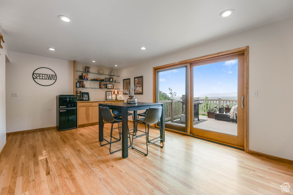 Dining area featuring light wood-style flooring and recessed lighting
