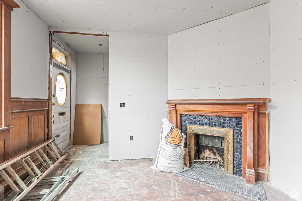 Unfurnished living room featuring a fireplace