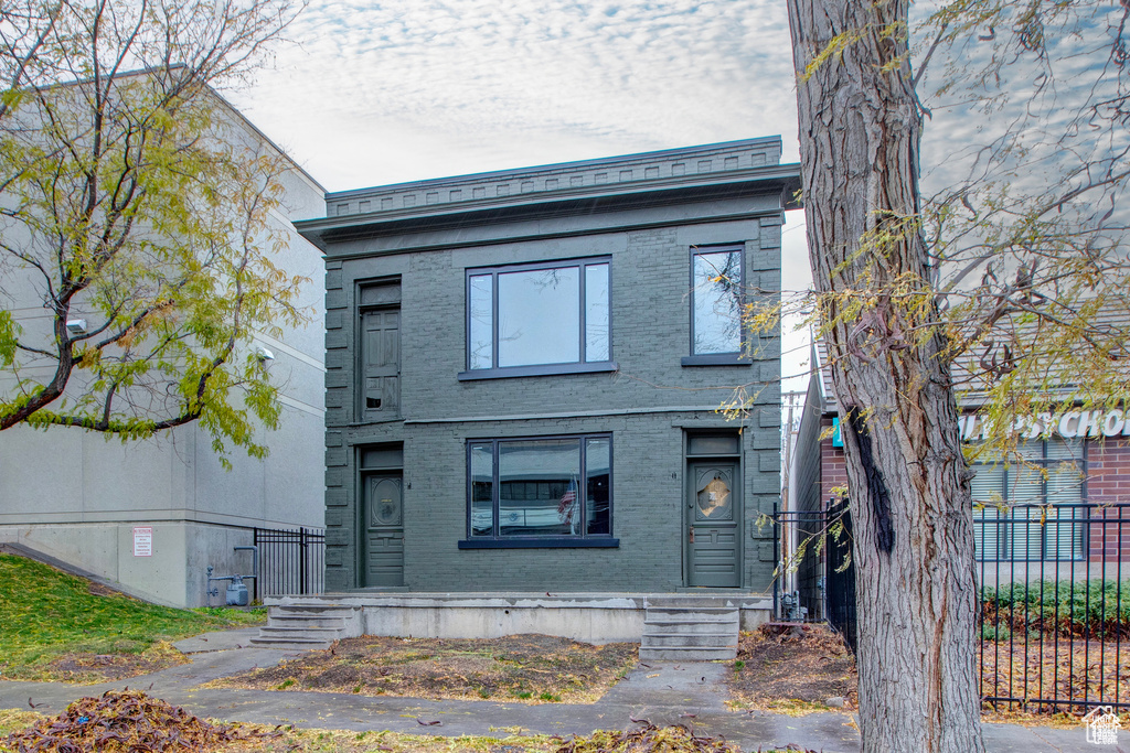 View of front of property with brick siding