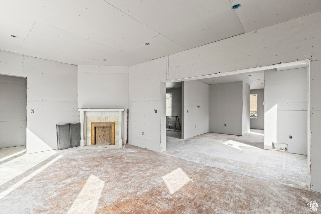 Unfurnished living room featuring a fireplace