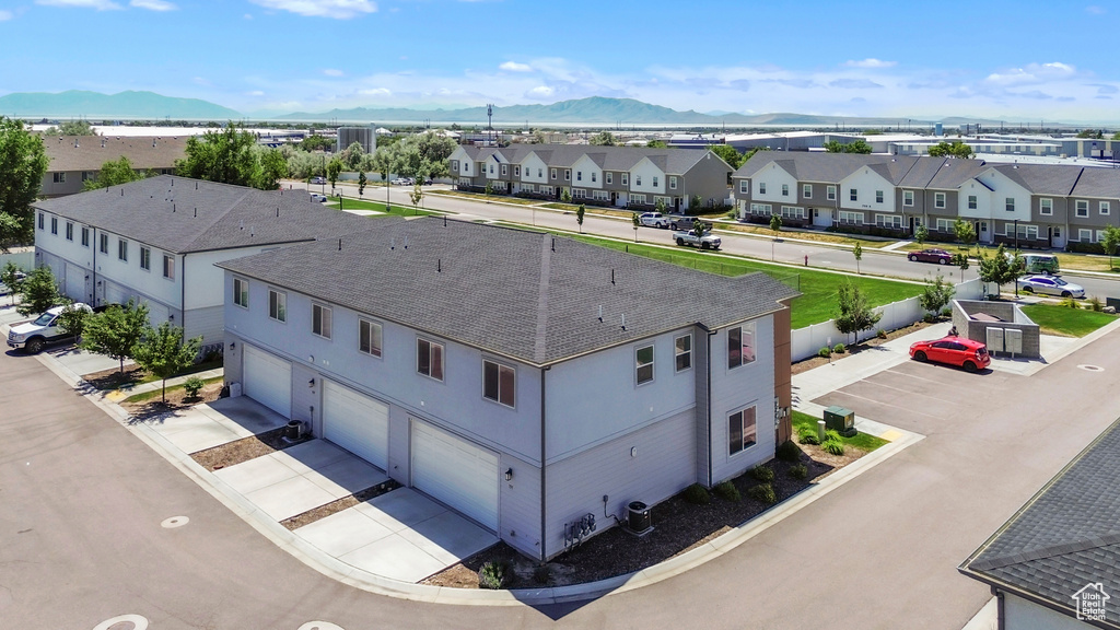Aerial view of residential area featuring mountains