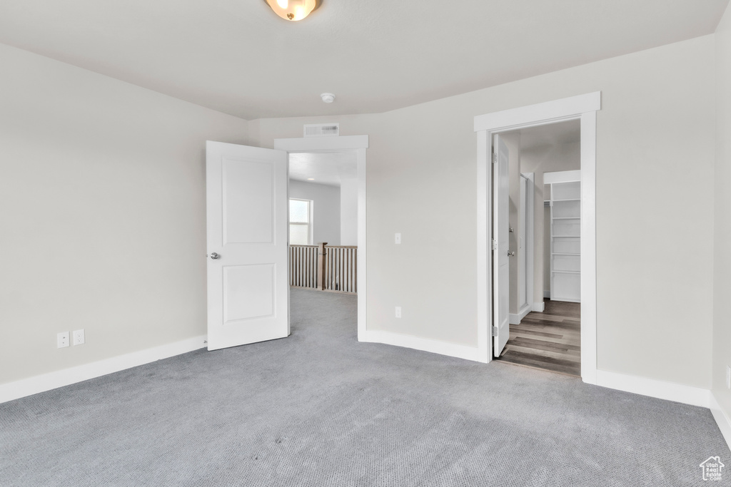 Spare room with carpet floors and baseboards