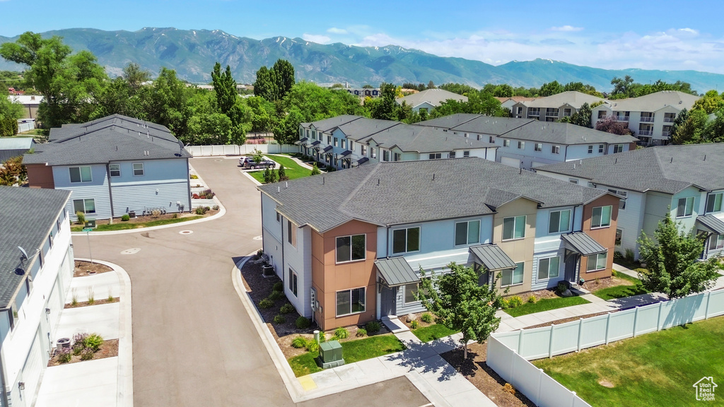 Aerial perspective of suburban area with a mountainous background