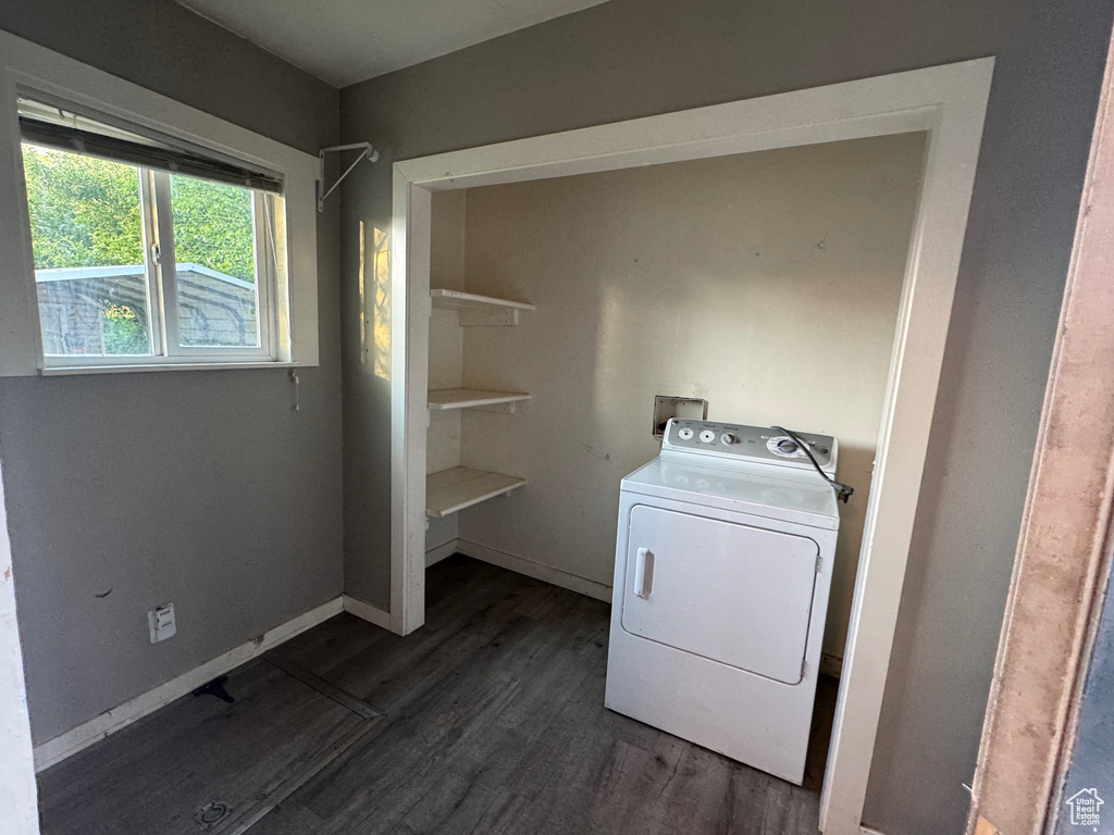 Washroom with washer / clothes dryer and dark wood-style flooring