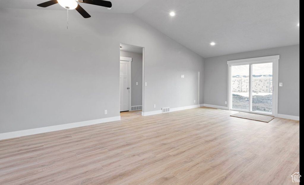 Unfurnished room with ceiling fan, light wood-type flooring, recessed lighting, and high vaulted ceiling