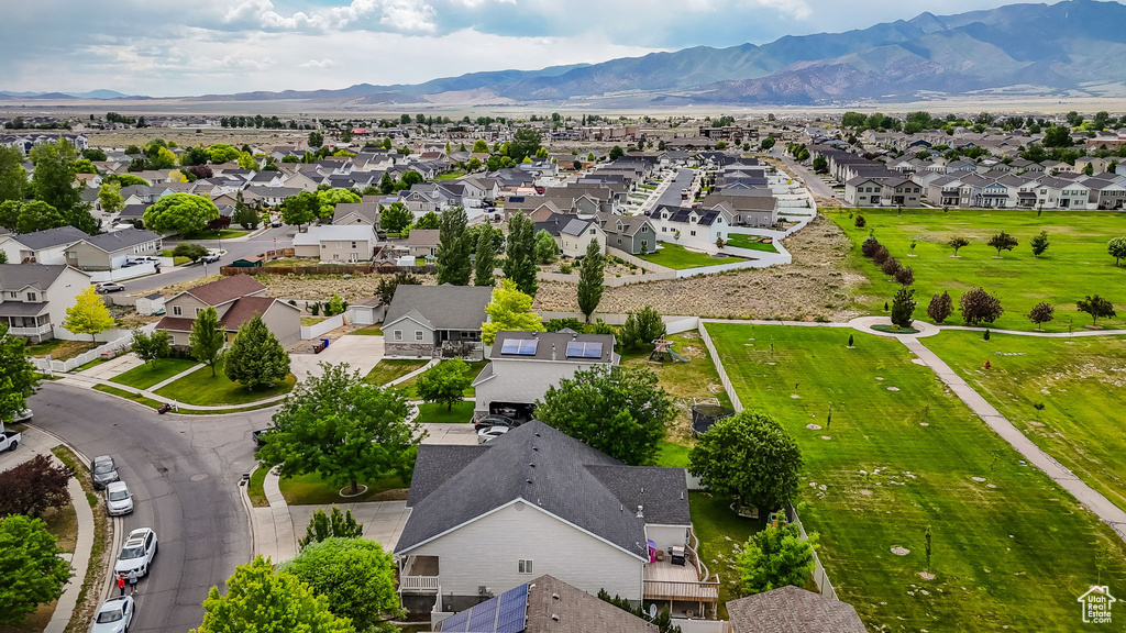 Aerial view of residential area featuring a mountain backdrop