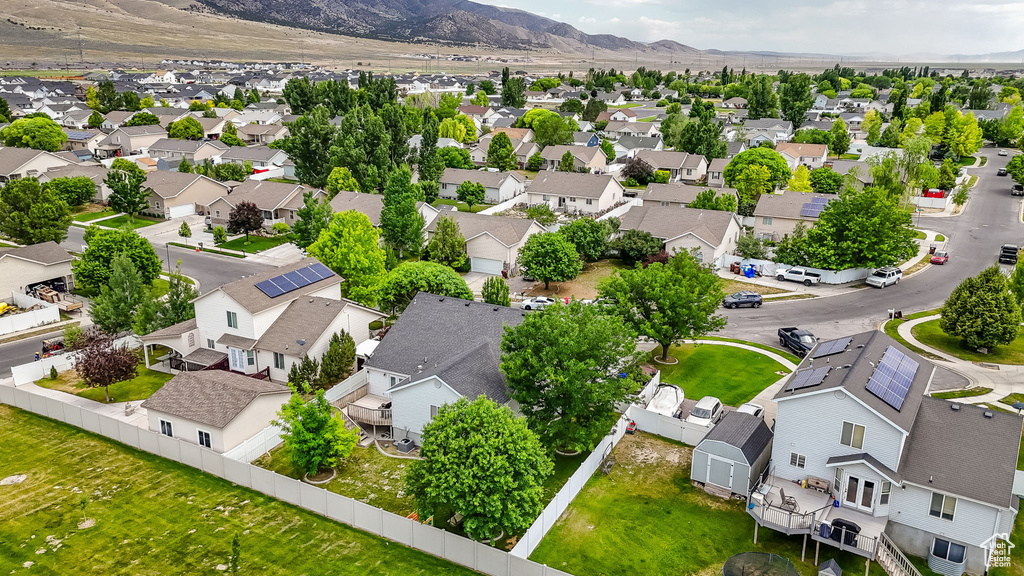 Aerial view of residential area featuring mountains