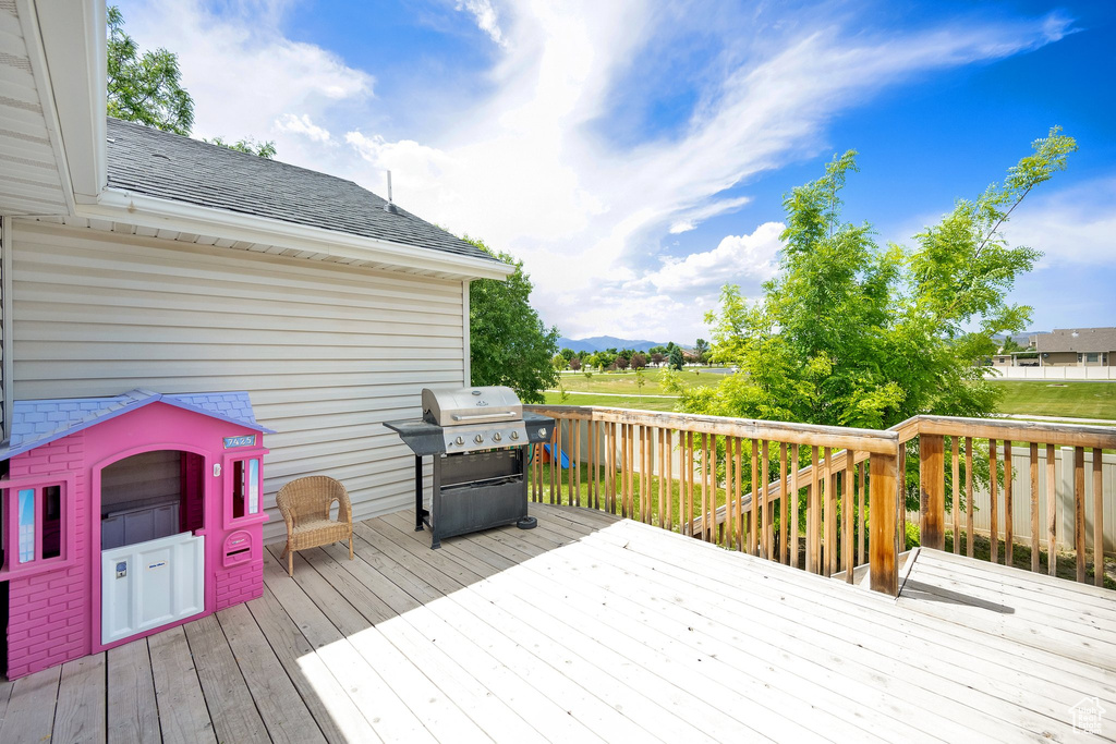 Wooden terrace with area for grilling