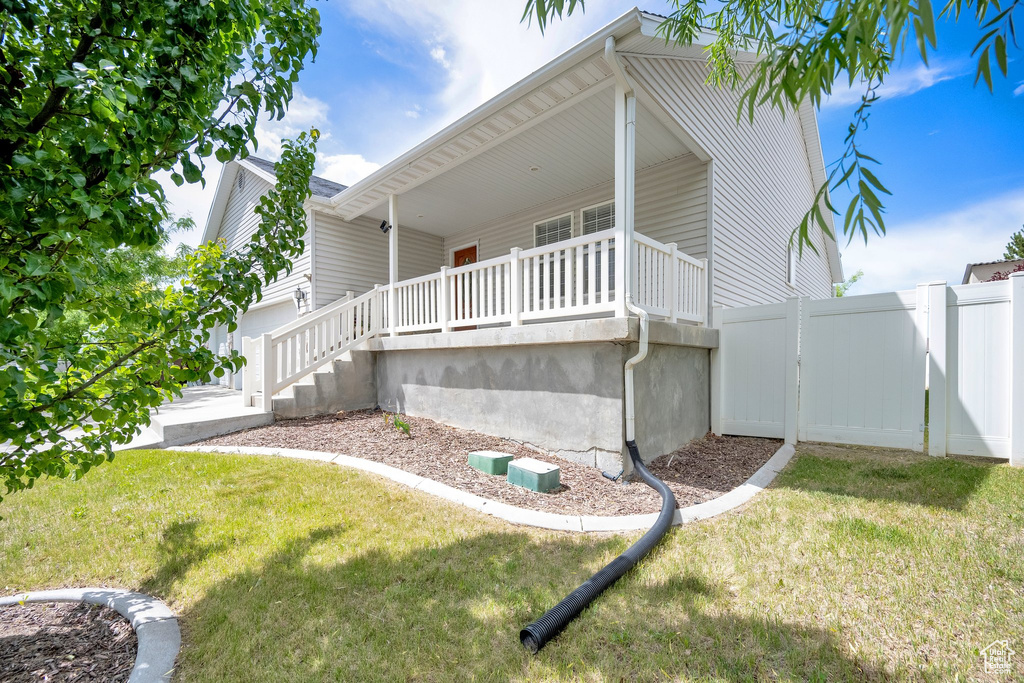 View of property exterior featuring a porch