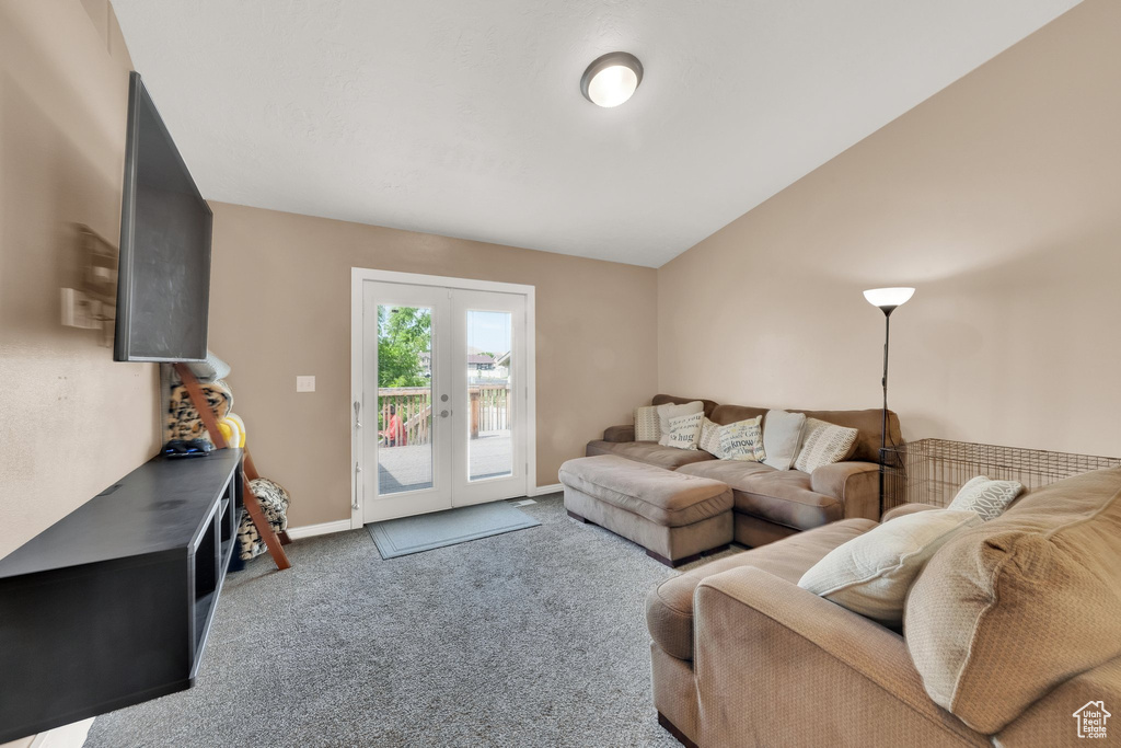 Living area with carpet floors and french doors