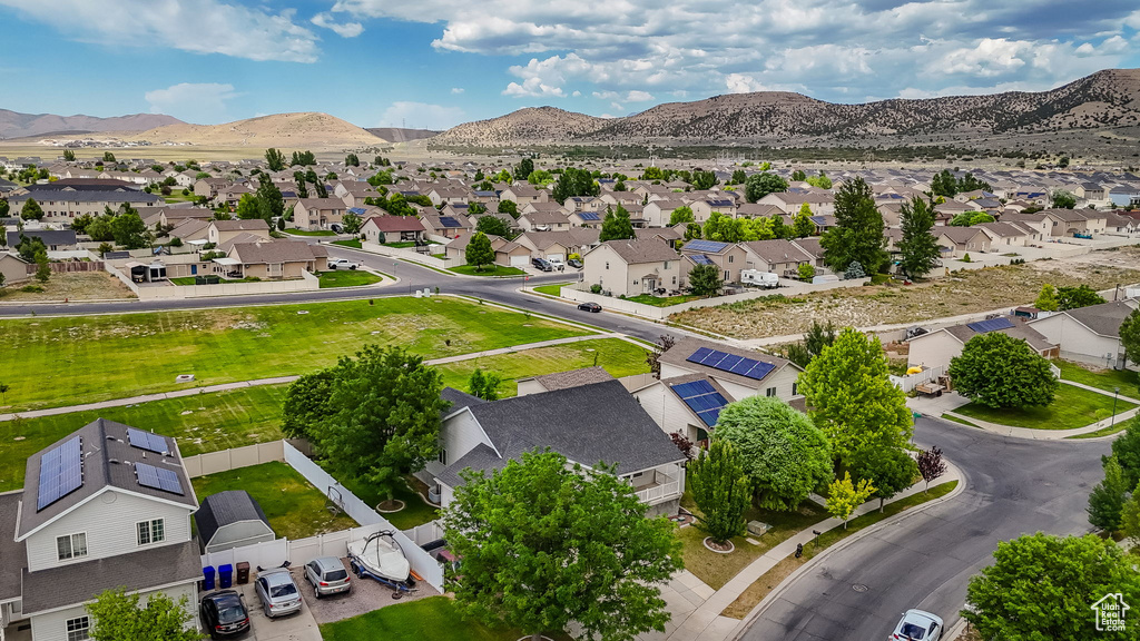 Aerial view of residential area featuring a mountain backdrop