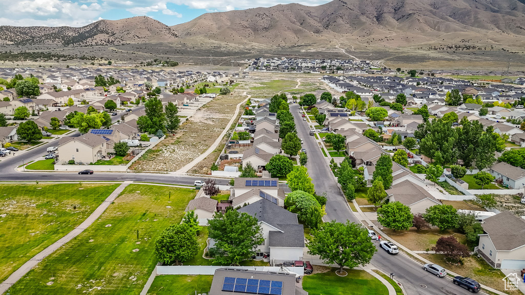 Aerial view of residential area featuring a mountain backdrop