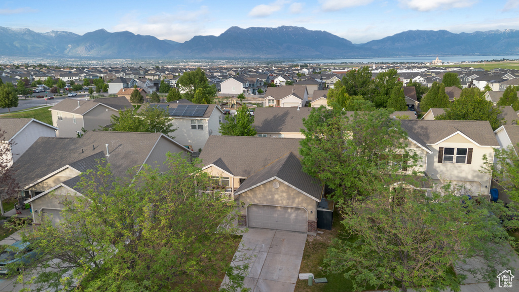 Aerial perspective of suburban area with a mountainous background